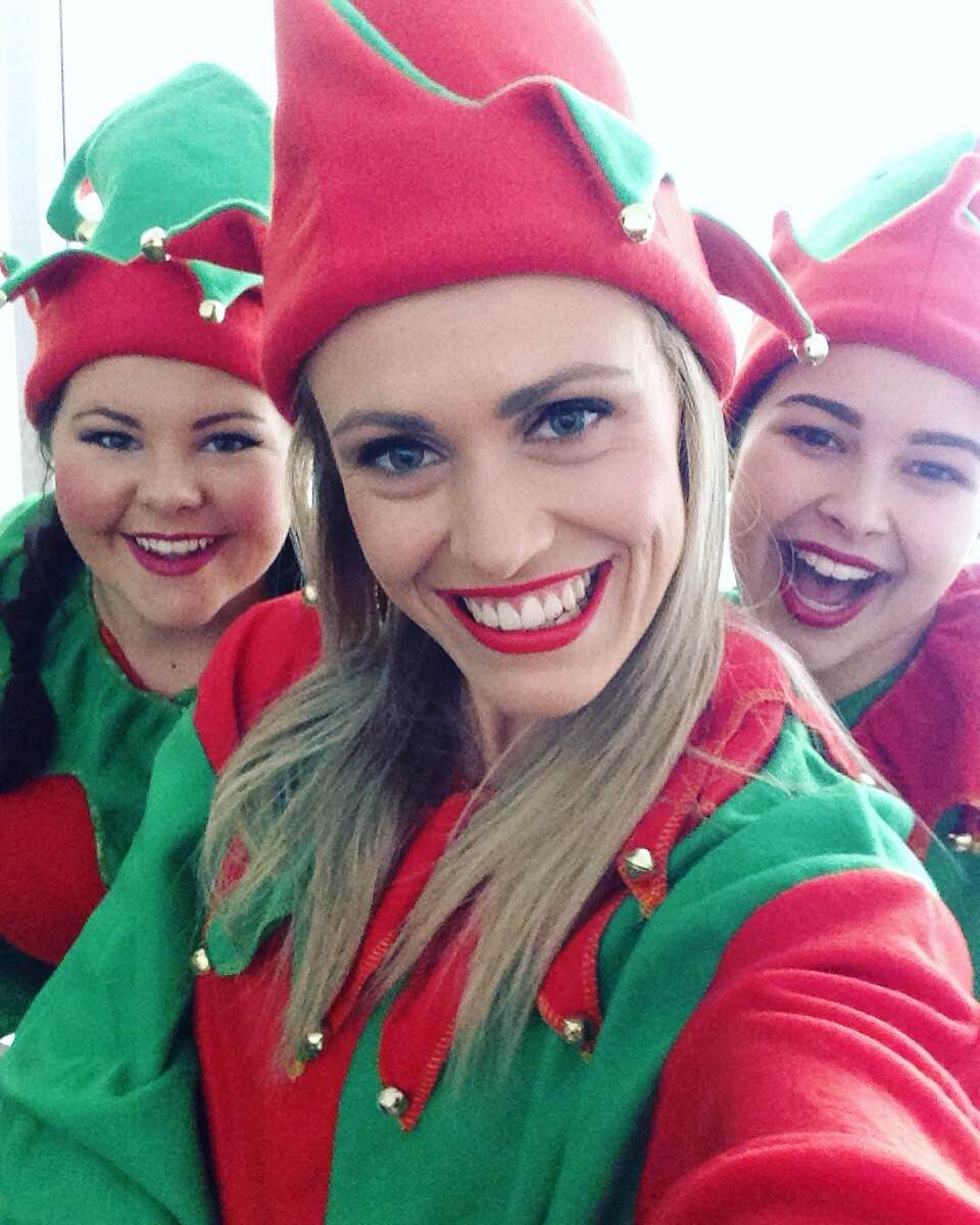 Three smiling elves taking a selfie