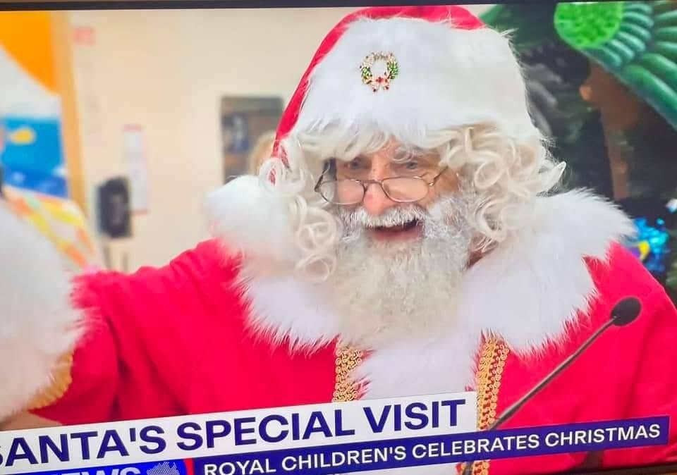 TV news segment Santa's Special Visit as Royal Children's celebrates Christmas with a Book a Santa performer