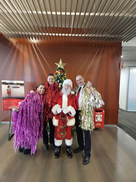 Santa with tinsel at a corporate Christmas event