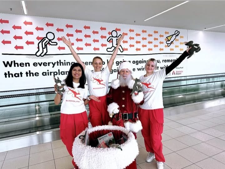 Santa and elves at an Adelaide airport Christmas event