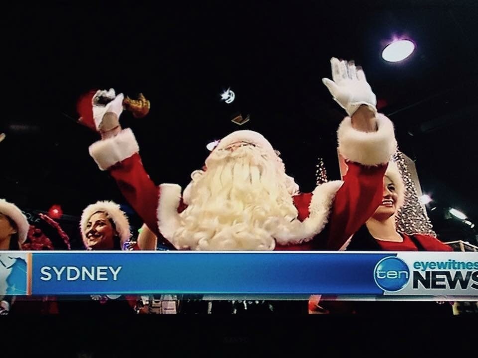 Book a Santa performer waving to the crowd live on Ten Eyewitness News in Sydney