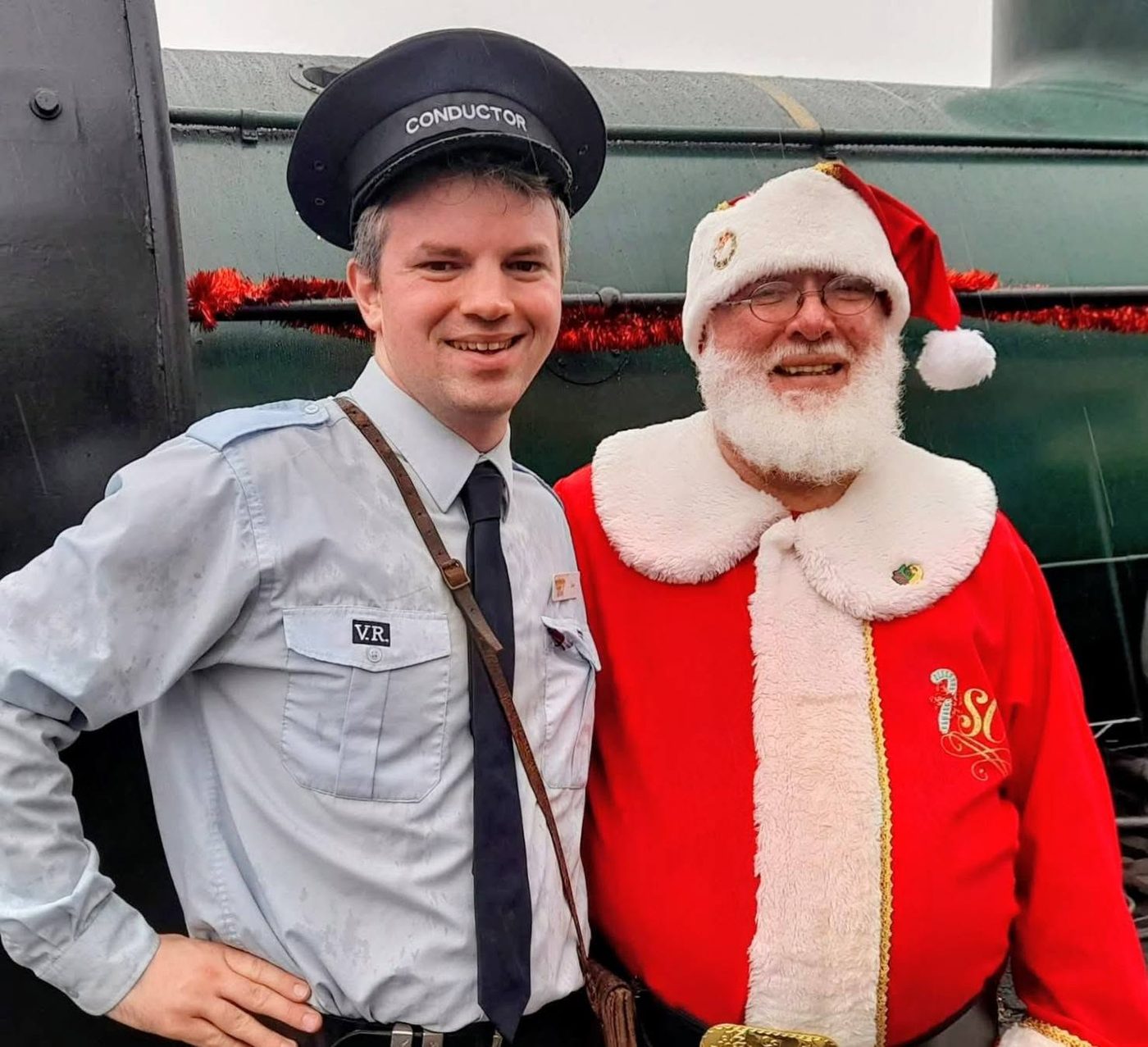 Santa Claus with a railway station attendant