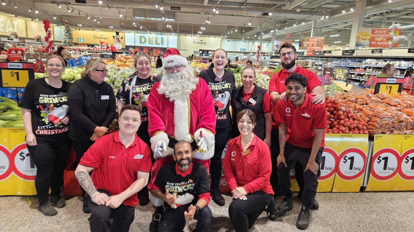 Santa Claus with a supermarket staff team
